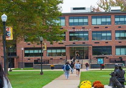 Students walking near Plassmann Hall.